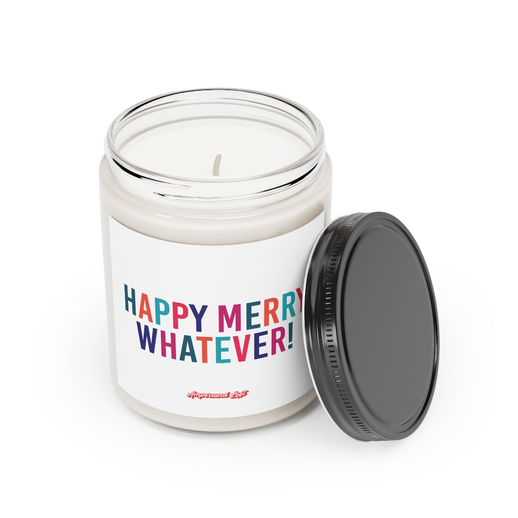 Candle in a glass jar with the lid off, resting on the side of the candle. White label that reads in alternating colourful (Teal, Orange, Blue, Pink, Navy) All-Caps text "Happy Merry Whatever!" and a small "Ampersand Loft logo below (pink retro font with solid red drop shadow)