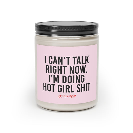 Candle in a glass jar with pink label that reads, in black All-Caps text "I Can't Talk Right Now. I'm Doing Hot Girl Shit." and a small "Ampersand Loft logo below (pink retro font with solid red drop shadow)